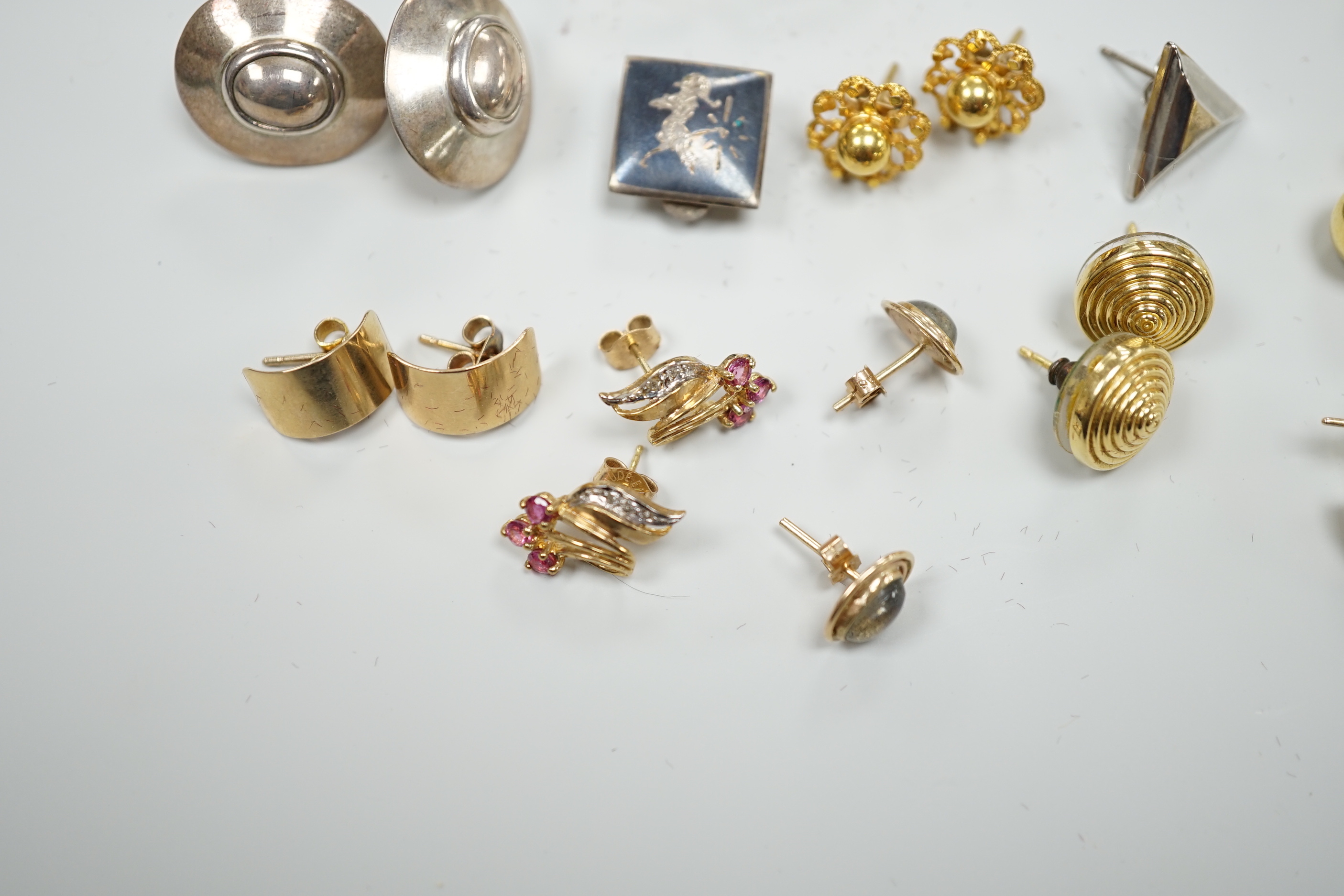 A modern pair of 9ct gold, gold, ruby and diamond earrings, boxed and nine other assorted pairs of earrings and two odd earrings.